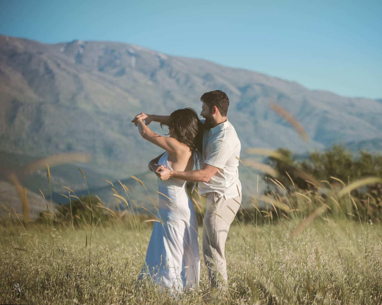 Amir and Lynn dancing in a mountain field